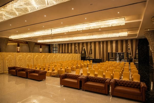 Grand ballroom seating arrangement with premium front-row leather sofas