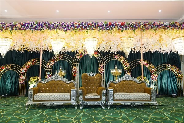 Royal emerald velvet and gold reception stage setup