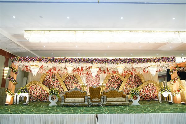 Traditional royal floral mandap with chandeliers